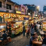 Culinary Paradise of Jakarta: 5 Reasons It's a Food Lover's Dream A bustling Jakarta street food scene at dusk with various food carts and a lively crowd.