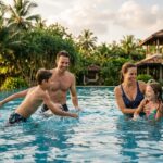 Family-Friendly Hotels in Sri Lanka: Best Resorts for 2026 A family with two children enjoying a tropical resort pool in Sri Lanka.