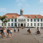 Cultural Heritage of Jakarta: 5 Key Highlights (2025 Guide) A historic colonial building in Jakarta with a public square in the foreground.