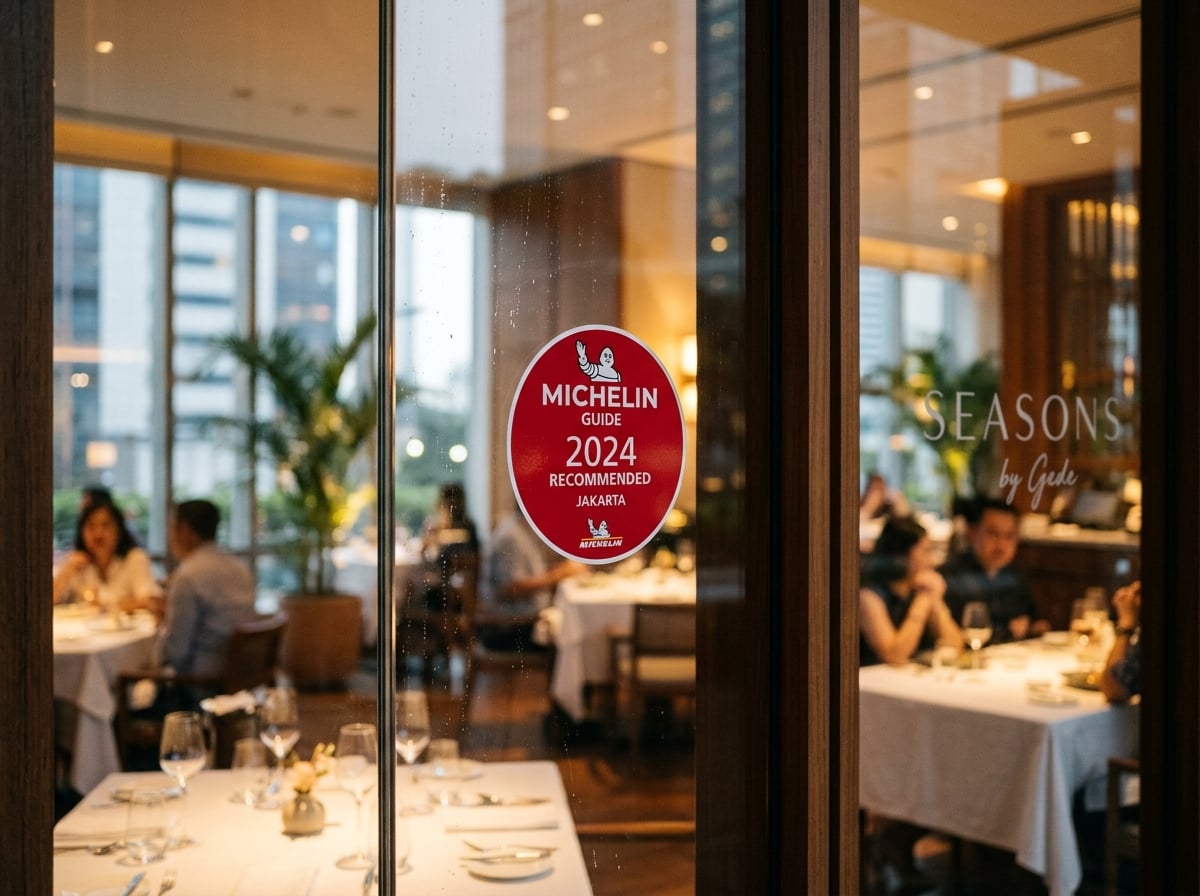 A Michelin Guide recognition sticker on a restaurant window in Jakarta.