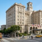 A historic luxury hotel building in San Francisco's Nob Hill against a clear sky.