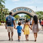 Best Hotels Near SeaWorld San Antonio for Families (2026) A family with two children walking hand-in-hand toward the entrance of SeaWorld San Antonio.