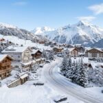 A picturesque view of Courchevel 1850 village nestled in the snowy French Alps.