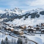 Best Hotels Courchevel 1650 (Moriond): Top Stays 2026 A modern ski resort village in the French Alps with snowy slopes.